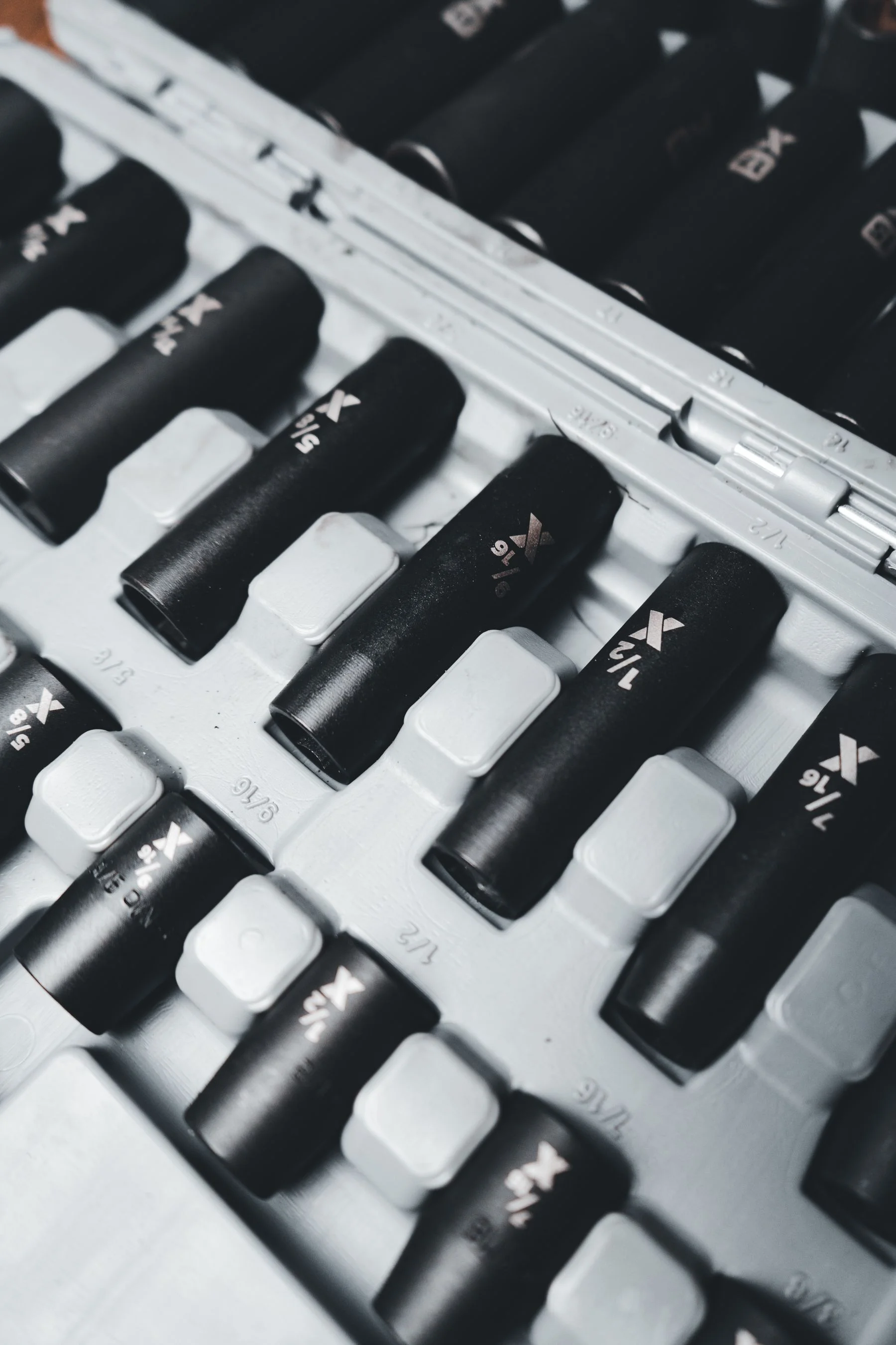 Impact sockets arranged in a fitted storage case